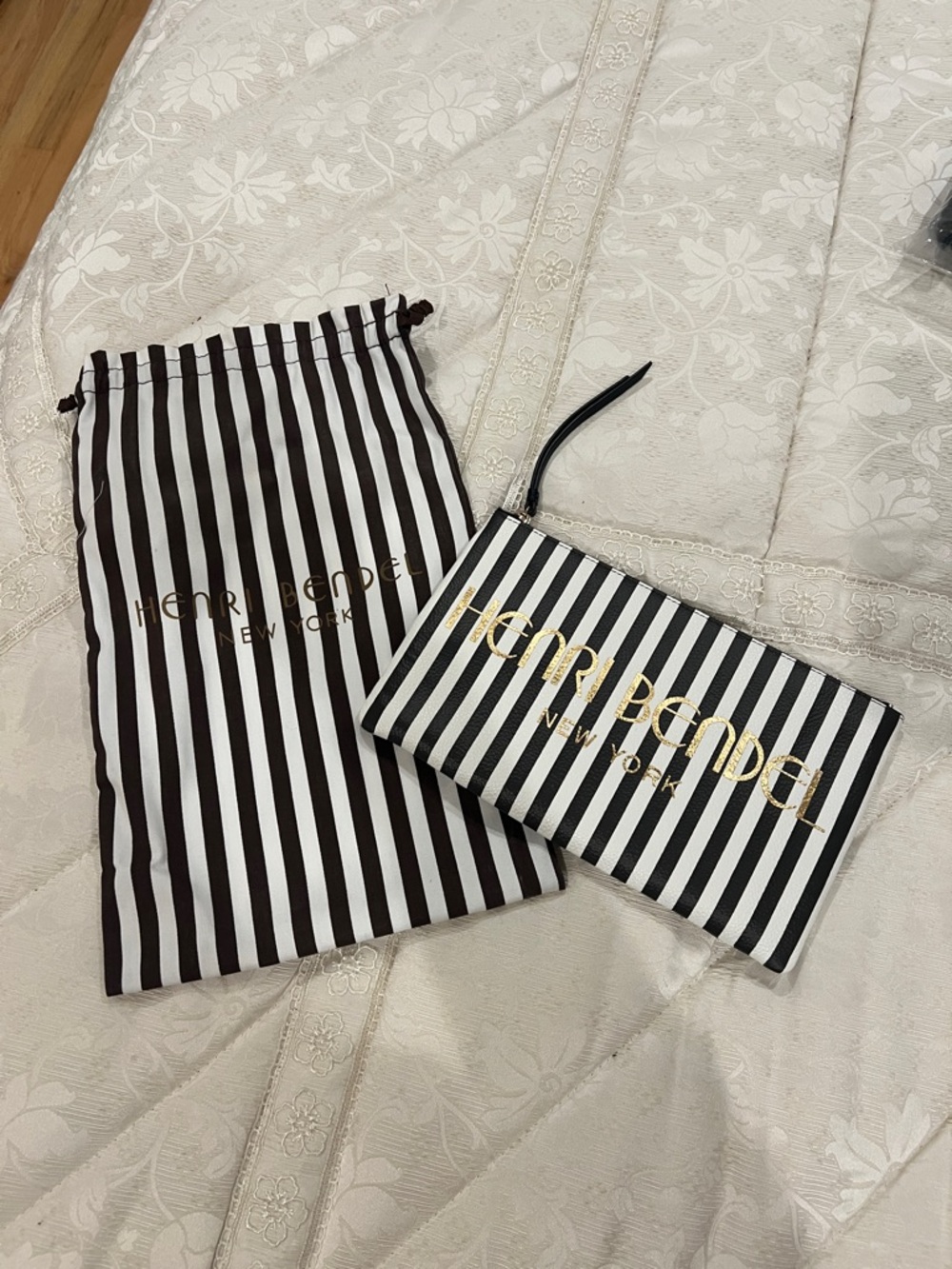 henri bendel Black & White Striped Wristlet with Gold Logo